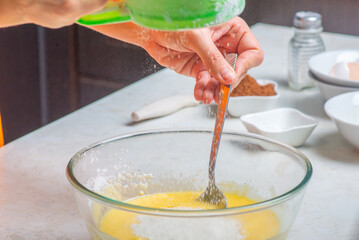 flour is added to the cup with the ingredients