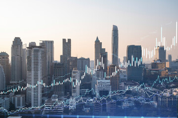 Fototapeta premium Market behavior graph hologram, sunset panoramic city view of Bangkok, popular location to achieve financial degree in Southeast Asia. The concept of financial data analysis. Double exposure.