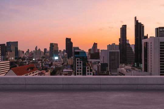 Panoramic Bangkok skyline view, concrete observatory deck on rooftop, sunset. Luxury Asian corporate and residential lifestyle. Financial city downtown, real estate. Product display mockup empty roof