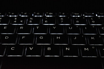 Laptop keyboard shot, with beautiful backlight.