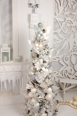 Glass christmas balls on snow tree branch