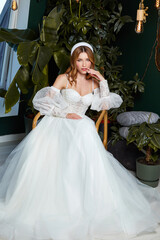 Beautiful tender young woman sexy brunette bride in a luxury white wedding dress lace chiffon...
