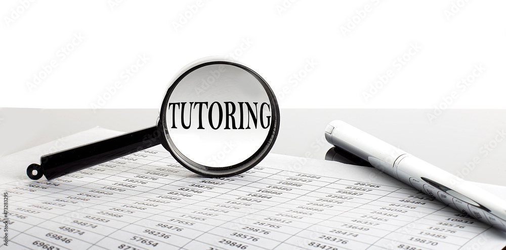 Poster magnifying glass with text tutoring on the background with pen