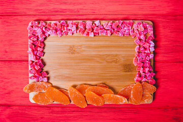Mixture of dried fruit  on a colorful  wooden background with copy space. View from above.