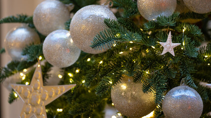 Obraz na płótnie Canvas Decorated Christmas tree. Vintage toning. Yellow star and white balls