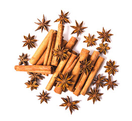 Cinnamon sticks and star anise spice isolated on white background closeup.