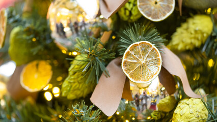 Christmas tree decorated with natural materials - slices of dried orange. © Sergey Privalov