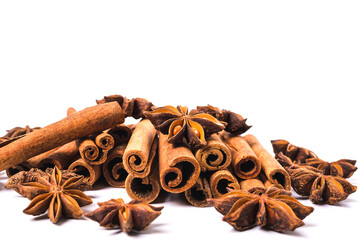 Obraz na płótnie Canvas Cinnamon sticks and star anise spice isolated on white background closeup.