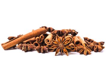 Cinnamon sticks and star anise spice isolated on white background closeup.