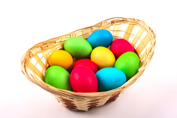 Fototapeta na wymiar Basket with easter eggs. White background.