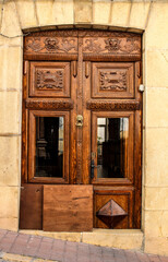 Old and beautiful carved wooden door in Polop