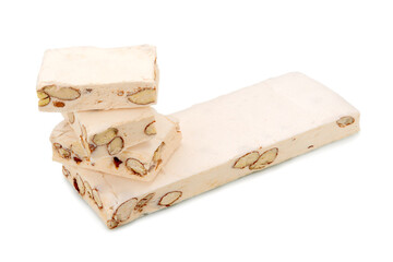 Soft nougat with almonds and hazelnuts isolated on white