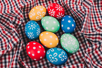 Perfect colorful handmade easter eggs on a fabric background