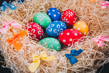 Perfect colorful handmade easter eggs in the nest