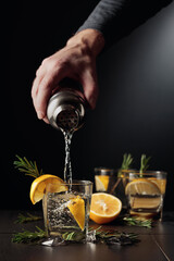 Cocktail Gin and Tonic with lemon and rosemary.