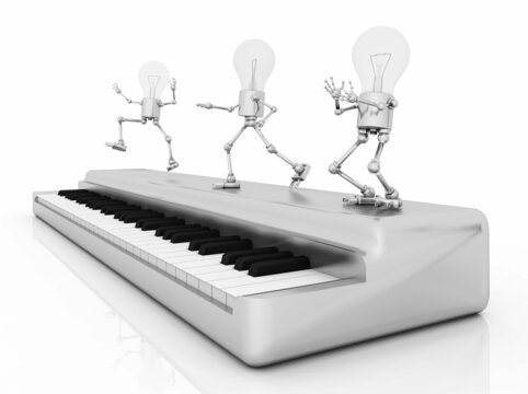Glühbirnen Figuren tanzen auf einem Keyboard