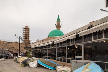 The Sinan Basha Mosque and the clock tower on the embankment at the port in Acre old city, in northern Israel - obrazy, fototapety, plakaty