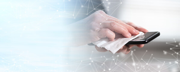 Woman disinfecting smartphone; prevention of virus and bacteria infection; panoramic banner