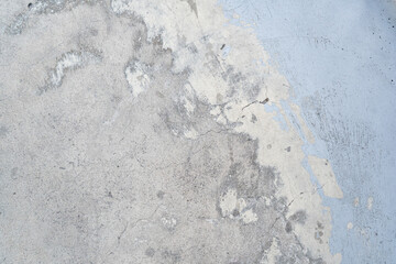 Concrete texture with worn out light blue paint