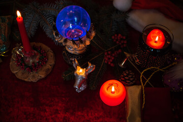 Winter Christmas prediction on a Candle and Tarot cards. Magical esoteric concept. Astrology and...