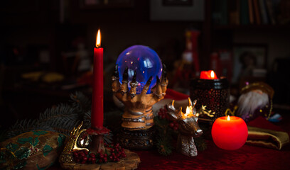 Winter Christmas prediction on a Candle and Tarot cards. Magical esoteric concept. Astrology and...