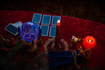 Winter Christmas prediction on a Candle and Tarot cards. Magical esoteric concept. Astrology and...