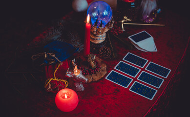 Winter Christmas prediction on a Candle and Tarot cards. Magical esoteric concept. Astrology and...