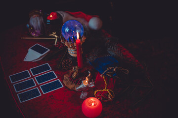 Winter Christmas prediction on a Candle and Tarot cards. Magical esoteric concept. Astrology and...
