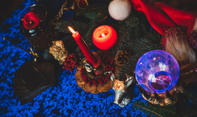 Winter Christmas prediction on a Candle and Tarot cards. Magical esoteric concept. Astrology and...
