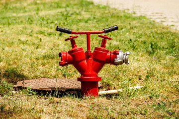 A red fire hydrant is installed in the hatch