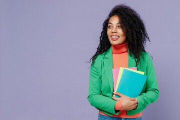 Teacher smiling elegant charismatic fun young black curly woman 20s wear green shirt looking aside...