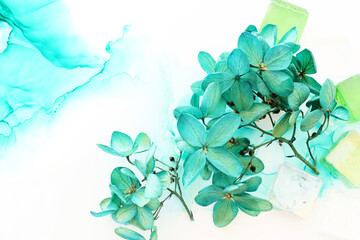 Creative image of emerald and green Hydrangea flowers on artistic ink background. Top view with copy space