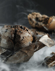 chocolate muffin with chocolate on a dark background