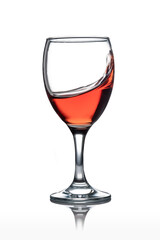 Moving red wine glass isolated from the white background
