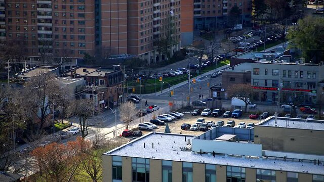 Busy intersection in city downtown neighbourhood in district - Shuter Street and Parliament Street East in Toronto, Ontario, Canada