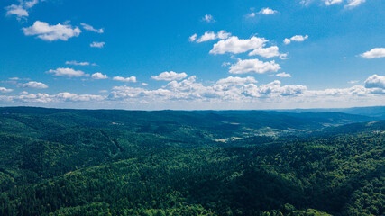 mountains aerial view in blue sky clouds