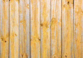 Obraz premium Old grey and yellow wooden background with cracks and scratches in vintage style