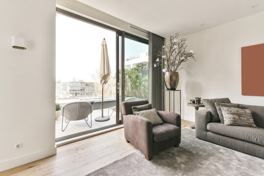 Interior Of Living Room With Balcony In Modern Flat