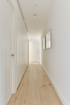Empty corridor with light walls in modern apartment