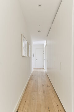 Empty corridor with light walls in modern apartment