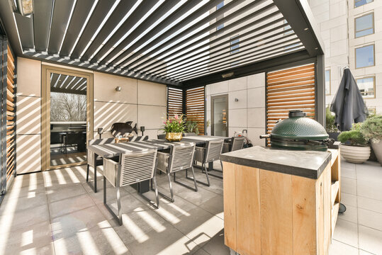 Spacious veranda with dining zone and grill