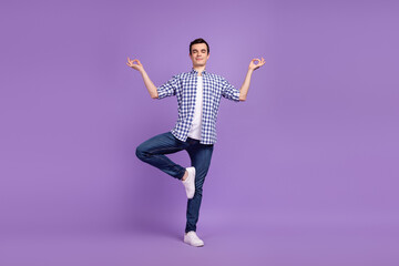 Fototapeta na wymiar Full size photo of young guy meditate asana balance zen concentrated isolated over violet color background