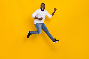 Fototapeta na wymiar Full length photo of overjoyed person raise fists triumph luck shout yes isolated on yellow color background