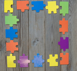 colored puzzle on wooden boards team business concept