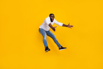 Fototapeta na wymiar Full size profile portrait of excited impressed person look empty space falling isolated on yellow color background