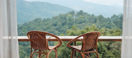 Couple chairs on balcony of countryside home or homestay with mountain view background in the...