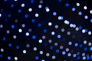 Blue bokeh lights on black background