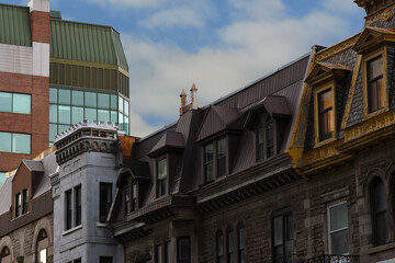 New and old roofs under a blue sky 