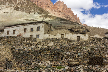 Old, rustic traditional stone walls and houses in the village of Kargiak in the Zanskar valley in Ladakh.