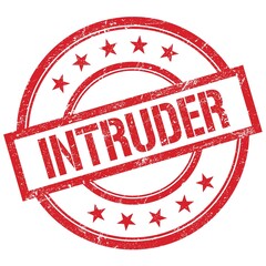 INTRUDER text written on red vintage stamp.